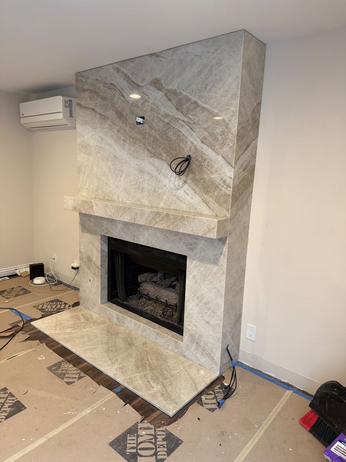 Taj Mahal quartzite fireplace surround with floating mantel