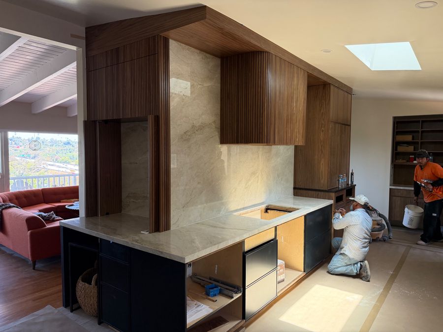 Taj Mahal quartzite kitchen with walnut cabinetry